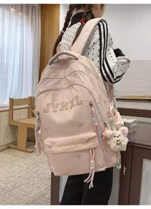 Casual pink canvas backpack with cute bow embroidery and plush bear pendant for daily travel.