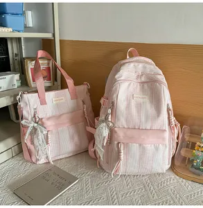 Pink striped canvas backpack and tote bag set with cute lace bow pendants for students.