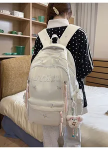 Casual white backpack with cute bow embroidery, large capacity and stylish design.