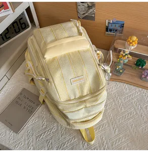 Yellow white striped casual student backpack with multi-pocket design and large capacity.