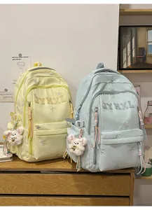 Casual canvas backpack with cute bow embroidery and plush bear pendant for daily use.
