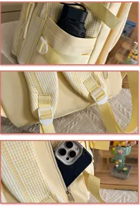 Yellow plaid school backpack detail view featuring front pocket, adjustable straps.