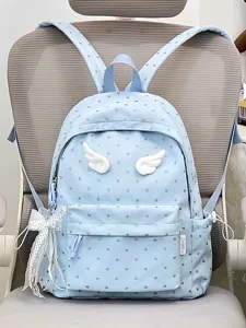 Cute light blue backpack for students with heart prints, white angel wings and lace bow pendant.