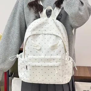 White cute heart print travel backpack with angel wings, casual school bag for daily use.