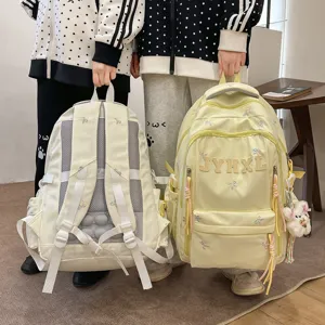 Korean style casual large capacity backpack with bow embroidery, comfortable spine protection design.
