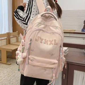 Cute pink bow embroidered casual backpack for women, large capacity school book bag travel daypack.