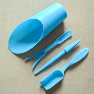 Detailed view of 4pcs blue plastic succulent gardening tool set including scoop and dibber.