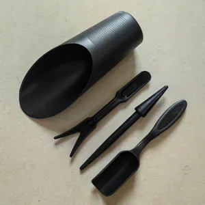 Closeup of 4pcs black succulent planting tools set including scoop fork and dibber.