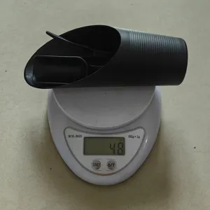 Detail view of succulent garden tool set showing weight measurement on a digital scale.