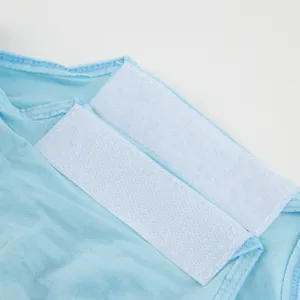 Close-up detail of the blue cat recovery suit featuring soft white hook and loop fasteners.