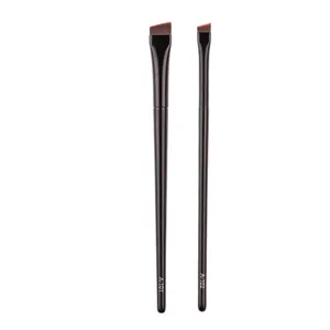 Detail shot of angled eyebrow and eyeliner makeup brushes, featuring fine flat tip and model codes.