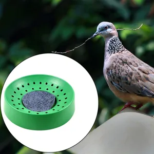 Plastic pigeon egg nesting bowl with felt pad, detail view showing breathable ventilation holes.