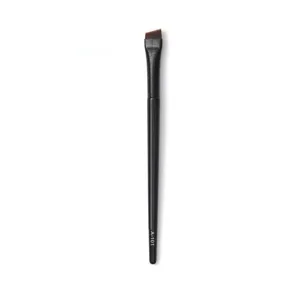 Close-up detail of the angled eyebrow and eyeliner makeup brush handle and bristle shape.