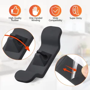 Enrouleur de câble pour appareil de cuisine en silicone noir avec adhésif fort et enroulement.
