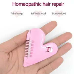 Detail view of the pink heart hair trimming comb, showing sharp blades and dual-sided design.