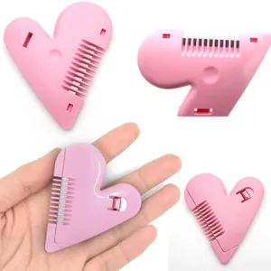Pink heart-shaped hair thinning comb and bangs trimmer tool for self hair cutting.