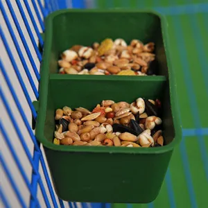 Double compartment plastic bird feeder bowl for wire cages, pet bird food container detail view.
