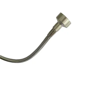 Flexible metal hose detail view of automotive torque angle gauge accessory, chrome finish.
