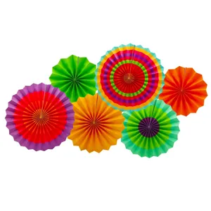 Colorful paper fan flower detail view, vibrant hanging decorations for party and wedding setup.