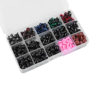 Detail shot of assorted safety eyes and noses in a 15-grid plastic storage box for DIY crafts.