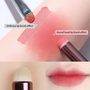 Round head lip brush detail showing soft bristle texture and smooth smudge effect on skin.