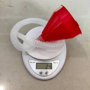 Extended plastic oil funnel with flexible corrugated tube for car and motorcycle maintenance.