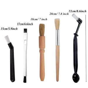 Coffee cleaning brush set with wooden and plastic handles for espresso machine maintenance.