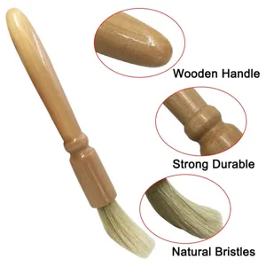 Coffee grinder cleaning brush with wooden handle and natural bristles for daily maintenance.