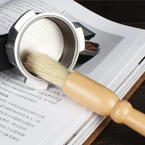 Wooden handle coffee cleaning brush detail view showing soft bristles cleaning portafilter