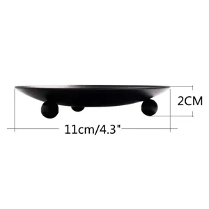 Placa de vela de hierro negro con tres pies redondos, bandeja de metal minimalista.
