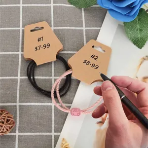 Kraft paper display cards for hair ties and jewelry, featuring blank folded design for retail use.