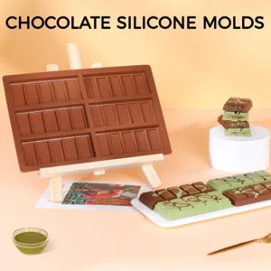 Detail view of rectangular silicone chocolate mold with six cavities on wooden easel.