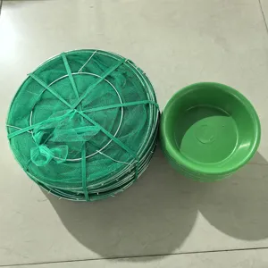 Folded hanging fly trap detail view, green mesh net structure with plastic basin accessory.