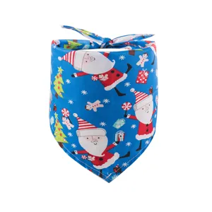 Detail view of the blue Christmas pet bandana featuring cute Santa and snowflake print patterns.