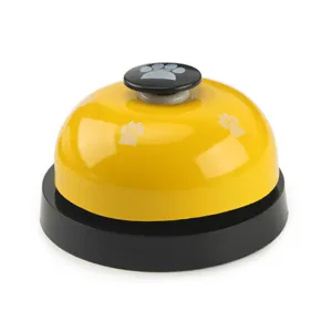 Cloche d'entraînement pour animaux en métal avec motif de pattes, idéale pour chats et chiens.