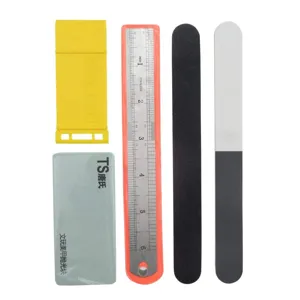 Modeler tool detail showing polishing blocks, metal ruler, and sanding sticks for crafts.