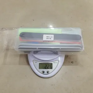 Detail view of the 18-piece model building tool set packed in a clear plastic storage box.
