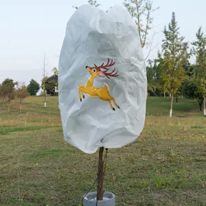 White non-woven plant frost protection cover with cute cartoon elk for winter garden.