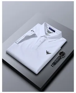 Detail view of a classic white men's short-sleeve polo shirt with lapel and neat chest logo.