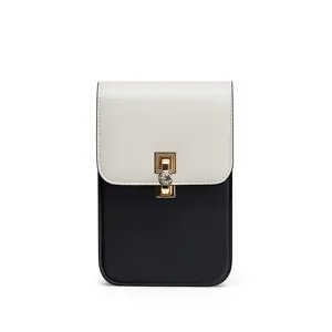 Borsa a tracolla per telefono nera e bianca chic con serratura dorata, elegante.