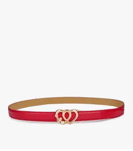 Detailed view of women's red leather belt featuring a chic gold double heart rhinestone buckle.