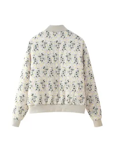 Detail view of women's floral print padded jacket showcasing the daisy pattern and rib knit hem.