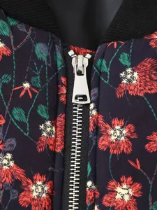 Detailed view of floral print padded jacket, metal zipper, ribbed collar texture.