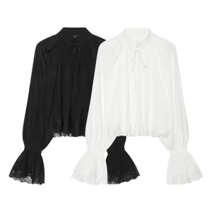 Elegante dames blouse met lange mouwen, kanten afwerking, opstaande kraag en strik.