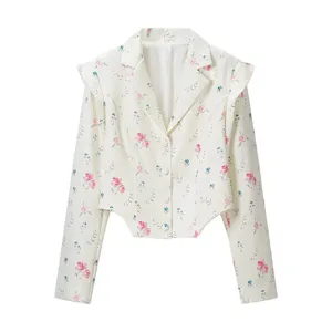 Detailed view of the white floral blazer jacket with pink flowers and chic lapel collar.