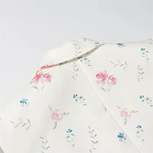 Close-up detail of the floral blazer collar, highlighting soft fabric and elegant print pattern.
