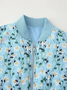 Close up detail of women floral print bomber jacket featuring ribbed collar and metal zipper.