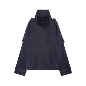 Detail view of the stylish navy blue short trench coat featuring a high collar and buttons.