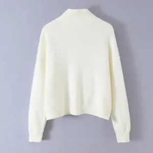 White high-neck knit sweater detail, soft textured fabric and comfortable fit for daily autumn wear.