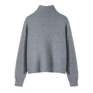 Grey knitted turtleneck sweater with long sleeves, drop shoulders, and ribbed hem details.